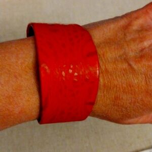 Kemestry red leather cuff bracelet.